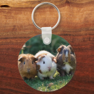 "Triple Squeak: Trio of Adorable Baby Guinea Pigs Key Ring