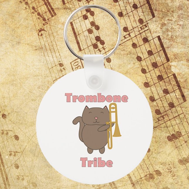 Trombone Tribe Cute Cat Pink Letters Key Ring (A keychain with a brown cat holding a trombone and the words trombone tribe in pink.)