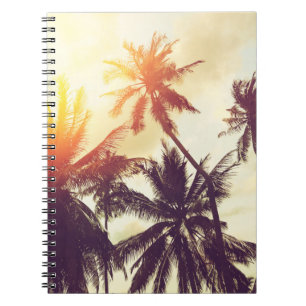 Tropical beach background with palm trees silhouet notebook