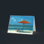 Tropical Beach Christmas Card Template<br><div class="desc">This card features an image of a sunny, tropical beach, complete with white puffy clouds, sailboats, seagull, and a wreathed beach umbrella with waiting lounge chairs. Inside template greeting says, "Wishing you a warm Christmas". Keep as is, or replace with your own words by typing over the text in the...</div>