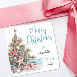 Tropical Beach Christmas Gift Tag Sticker<br><div class="desc">Tropical Christmas Tree Gift Tag. Add a beachy twist to your holiday wrapping with this square gift tag featuring a watercolor Christmas tree decorated with orange-red starfish and ornaments. The tree is placed on the left side of the tag, sitting in soft sand with a hint of teal-blue ocean water...</div>
