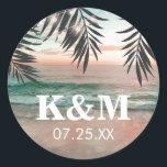 Tropical Beach Wedding | String of Lights Monogram Classic Round Sticker<br><div class="desc">Beach destination monogram stickers featuring a tropical palm beach setting, string twinkle lights, and a modern text template. Click on the “Customise it” button for further personalisation of this template. You will be able to modify all text, including the style, colours, and sizes. You will find matching items further down...</div>