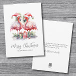 Tropical Christmas Holiday Card<br><div class="desc">Celebrate the holidays with a touch of the tropics with this charming print featuring two pink flamingos wearing Santa hats and standing beside Christmas presents. Whether you live in a coastal area like Florida, Hawaii, the Bahamas, or simply love the beach vibe, this fun and girly print is perfect for...</div>