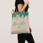 Tropical Flowers and Palm Branches Bride Tote Bag<br><div class="desc">This bridesmaid bag offers a graphic of bright coloured tropical flowers and green palm branches across the top of the bag. The word "Bride" appears in trendy hand written style text. To make this bag truly unique and personal,  you can also personalise it with your name.</div>