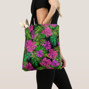 Tropical flowers and plants on black tote bag