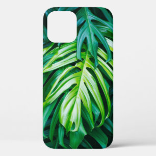 Tropical green leaves on dark background, nature s iPhone 12 case