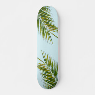 Tropical Green Palm Frond on Light Blue Skateboard