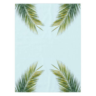 Tropical Green Palm Frond on Light Blue Tablecloth