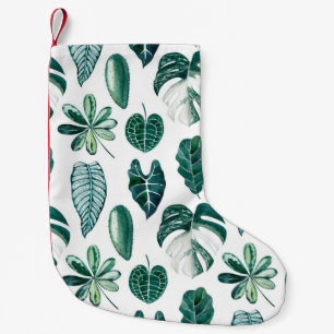 Tropical leaves watercolor seamless pattern with m small christmas stocking