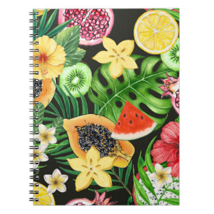 Tropical mix-fruit, flowers and leaves on black notebook