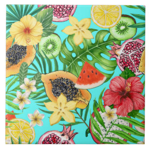 Tropical mix-fruit, flowers and leaves on blue ceramic tile
