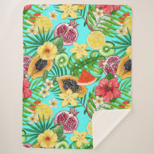Tropical mix-fruit, flowers and leaves on blue sherpa blanket