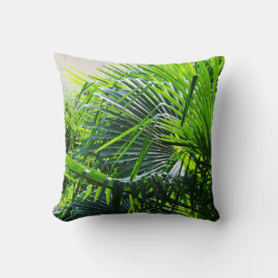 Tropical palm leaves cushion