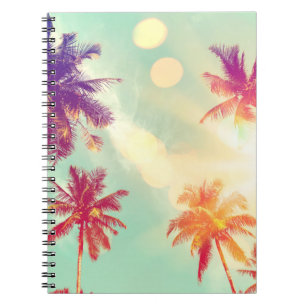 Tropical palm tree with colourful bokeh sun light notebook