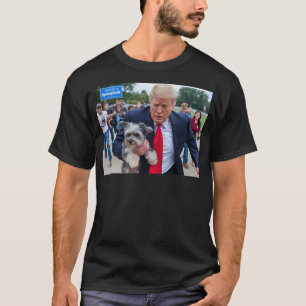 Trump Saving A Dog Funny Eating Dogs Political Hum T-Shirt