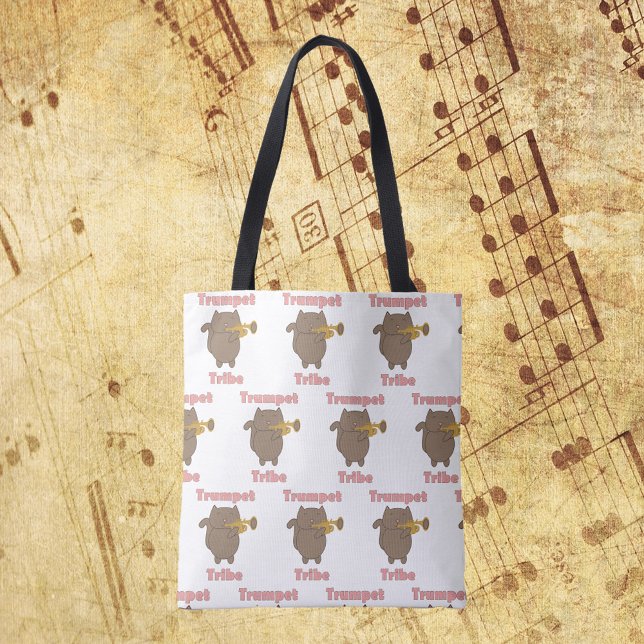 Trumpet Tribe Brown Cat Pattern Tote Bag (A tote bag with a pattern of a cat playing the trumpet and the words trumpet tribe in pink.)