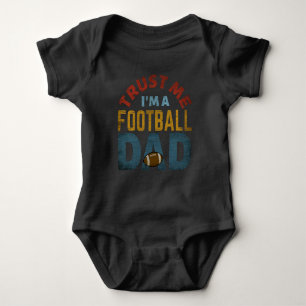 TRUST ME I'M A FOOTBALL DAD BABY BODYSUIT