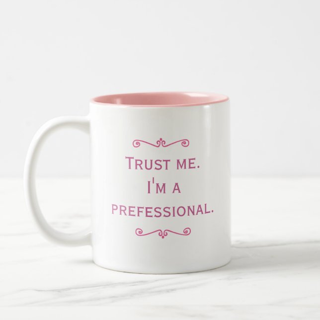 Trust Me. I'm A Prefessional. (Pink) Two-Tone Coffee Mug (Left)