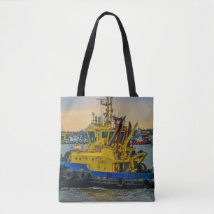 Tugboat sailing at river, montevideo, uruguay tote bag