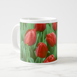 Tulip field blooms in the spring. large coffee mug