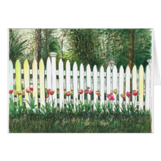 Tulips by the white fence