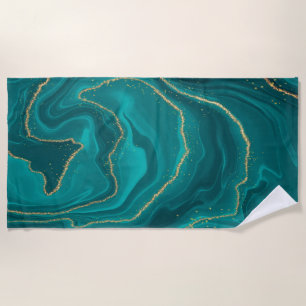Turquoise liquid marble background with gold beach towel
