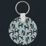 Tuxedo Black and White Cats Key Ring<br><div class="desc">Cute black and white tuxedo cats going about their business. A fun pattern on a mid blue background.</div>