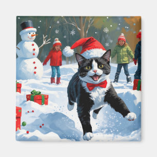 Tuxedo Cat Running in Snow with Christmas Hat Magnet