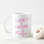 TWENTY & THRIVING 20th Birthday Funny Personalised Coffee Mug<br><div class="desc">Celebrate her fabulous twenties with this bold and fun TWENTY & THRIVING mug in vibrant pink – perfect for coffee, tea, or her favourite hot beverage. This personalised 20th birthday gift features a modern, playful design and her name for a unique and thoughtful custom touch. Ideal for best friends, daughters,...</div>
