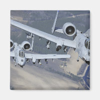 Two A-10C Thunderbolt II aircraft fly in format