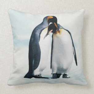 Two affectionate penguins cushion