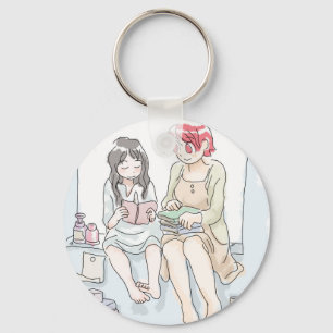 Two barefoot female illustrations sitting at the w key ring
