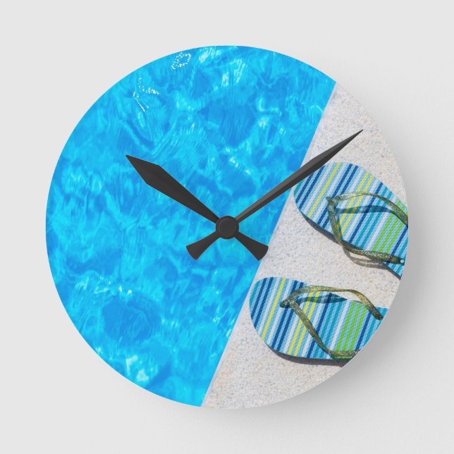 Two bathing slippers on edge of swimming pool round clock (Front)