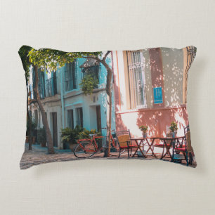 Two brown table outside decorative cushion