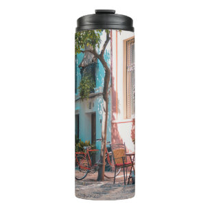 Two brown table outside thermal tumbler