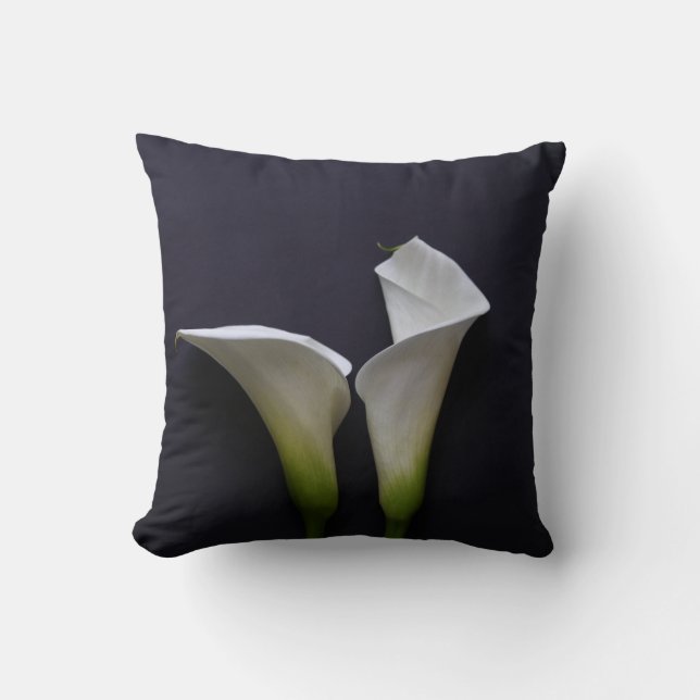 Two calla lilies on black cushion (Front)