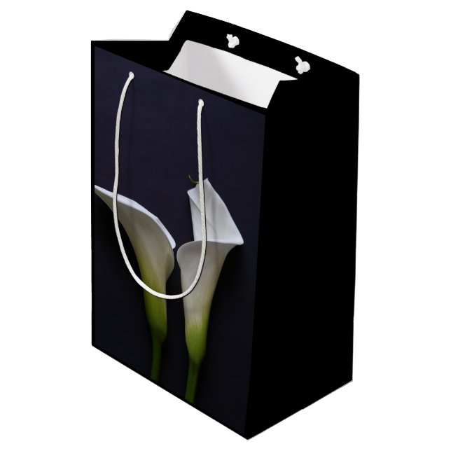 Two calla lilies on black  medium gift bag (Back Angled)