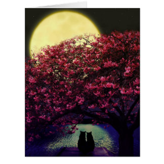 Two cats under a cherry tree in the moonlight 