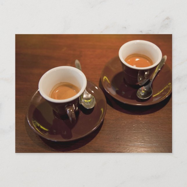 two cups of freshly brewed espresso coffee on a postcard (Front)