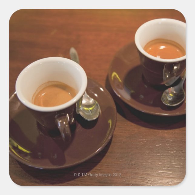 two cups of freshly brewed espresso coffee on a square sticker (Front)