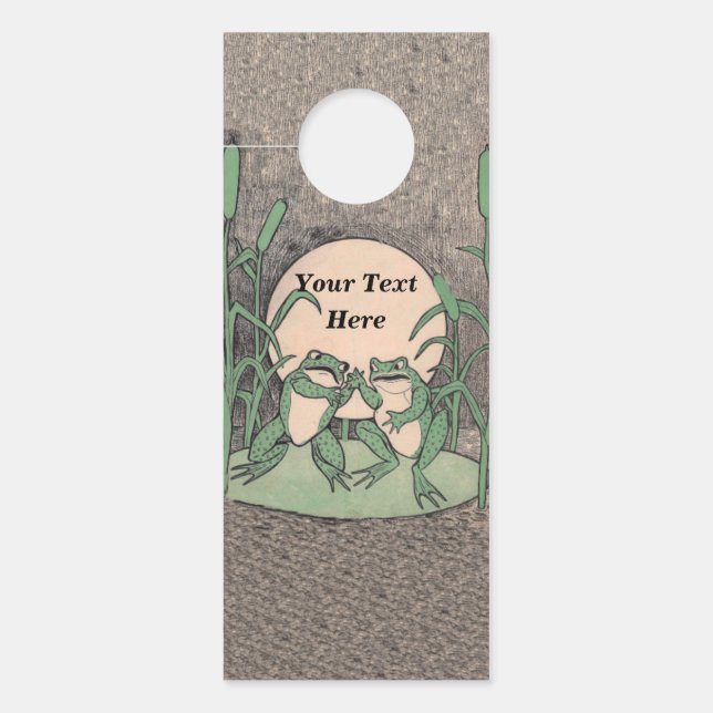 Two Cute Green Frogs Arguing on Lily Pad Moon Door Hanger (Front)