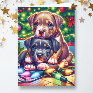 Two Cute Puppies Playing under the Christmas Tree Holiday Card