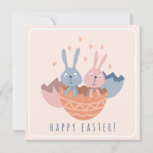 Two Easter bunnies in an eggshell.