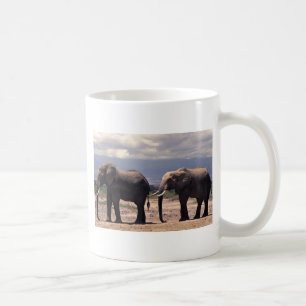 Two elephants walking in a row coffee mug