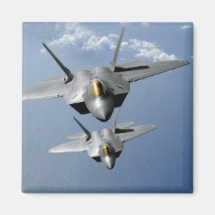 Two F-22 Raptors fly over the Pacific Ocean Magnet