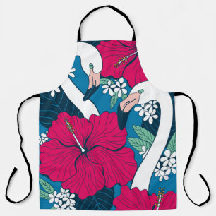 Two flamingos among hibiscus and plumeria flowers apron