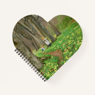 Two girls picking flowers in spring forest notebook