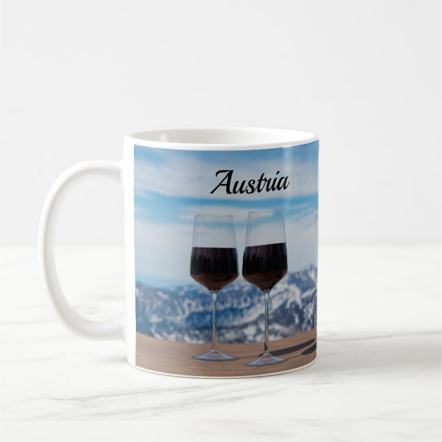 Two glasses of red wine against mountains coffee mug (Left)