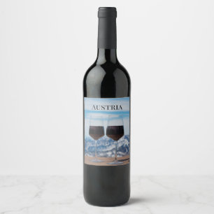 Two glasses of red wine against mountains label