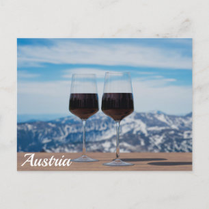 Two glasses of red wine against mountains postcard